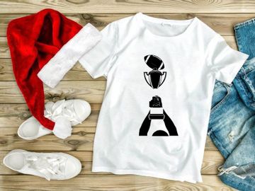 A person holding a trophy with a football on top in black and white preview picture