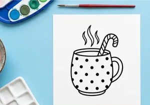 Steaming hot coffee in polka dot mug with candy cane stirrer for festive Christmas morning