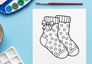 Cute baby booties with polka dots and festive bow for holiday gift or newborn photography props