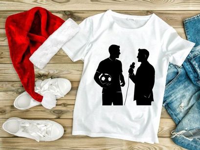 Silhouette of soccer player being interviewed on field with ball