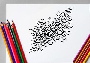 Flock of bats flying in the night sky for Halloween or wildlife scene