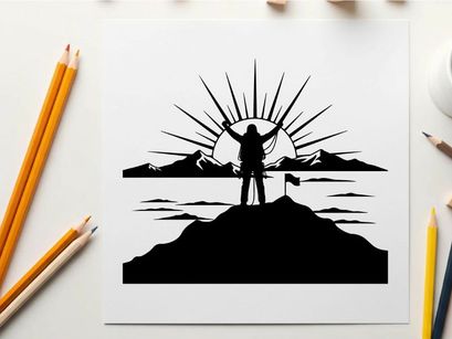 Silhouette of a person standing on a mountain at sunrise