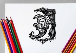 Elegant ornate letter 'J' with decorative curtain and frame
