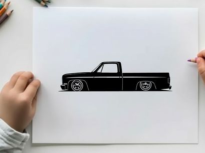 Silhouette of a classic lowered pickup truck with large wheels