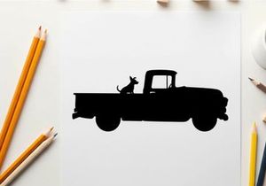 Silhouette of a dog sitting in the back of a vintage pickup truck