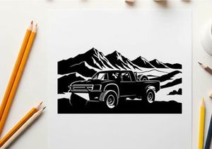 Silhouette of a pickup truck in front of majestic mountains silhouette