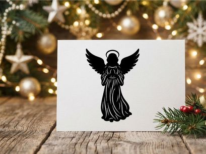 Black silhouette of a Christmas angel with wings and halo isolated on white background