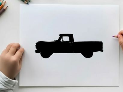 Silhouette of a classic pickup truck against a white background