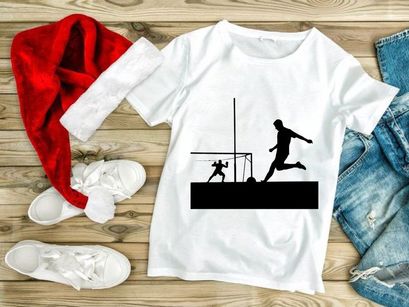 Soccer player kicking ball while goalkeeper attempts to block in a match