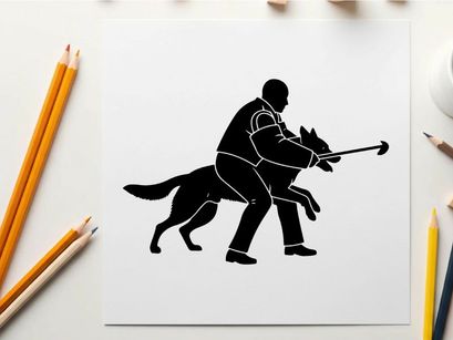 Silhouette of a man and dog in a training exercise with tug toy