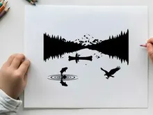 Serene silhouette landscape with eagle and mountain reflection