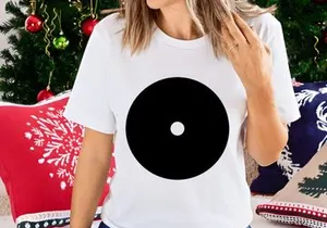 A black vinyl record with white concentric circles and a central dot