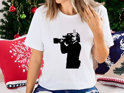 A person holding a video camera and recording