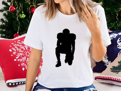 American football player in ready position on white background