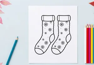 Pair of festive Christmas socks with snowflakes and ribbons for holiday celebrations