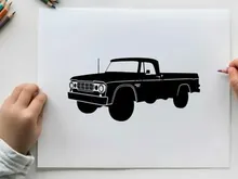 Silhouette of a classic pickup truck with large tires