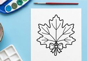Cozy autumn scene with a decorative maple leaf. Warm, inviting fall decor for seasonal celebrations.