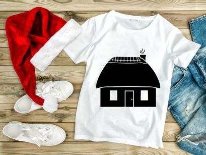 Thatched roof cottage with smoking chimney