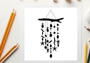 Silhouette of a driftwood wind chime with starfish and sea inspired shapes