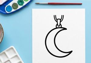 Minimalist silver moon pendant necklace on white background. Elegant crescent moon jewelry for women and fashion accessories.