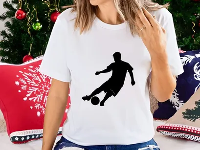 Soccer player kicking a ball in dynamic motion on the field