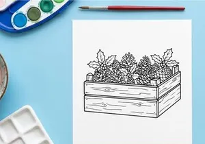 Kotak hadiah Natal kayu buatan tangan yang diisi dengan ranting cemara beku dan daun eukaliptus