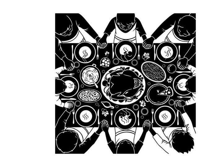 Silhouette of people gathered around a table with food in a symmetrical pattern