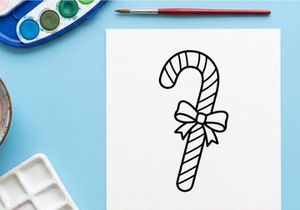Christmas candy cane line art illustration with a decorative bow for holiday design