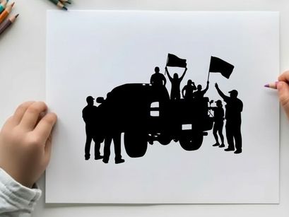 Silhouette of people on a truck waving flags in celebration