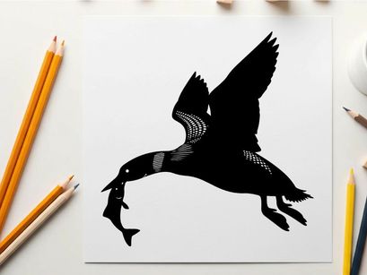 Silhouette of a bird in flight with prey
