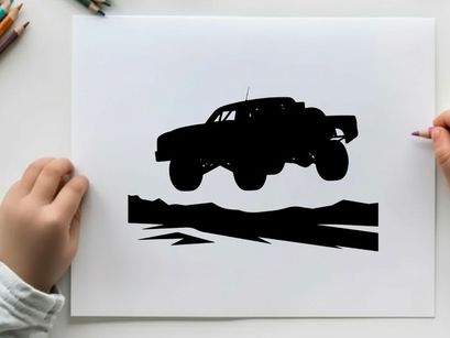 Silhouette of a monster truck in air with large wheels