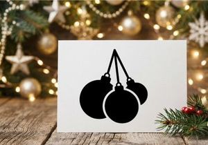 Black silhouette of three Christmas baubles hanging on a white background