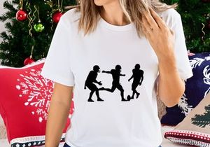 Silhouette of three soccer players in action on the field