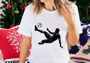 Soccer player in mid air kicking a ball with leg extended