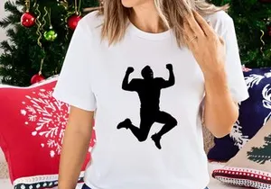 A silhouette of a person jumping up in the air with fists raised in triumph