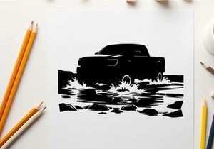 Silhouette of a pickup truck driving through water on a road