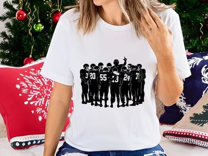 American football team huddle in black and white silhouette