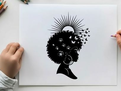 Silhouette of a woman with afro and sun rays