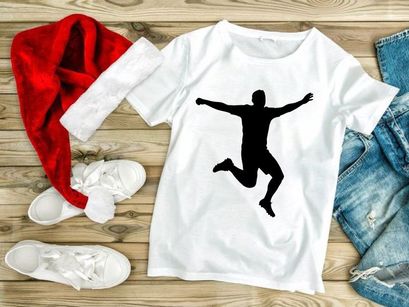 A person jumping in the air with arms outstretched in a celebratory pose silhouette