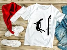 Silhouette of a soccer player in mid air heading the ball near the goal