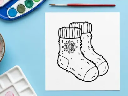 Hand-drawn white knitted Christmas baby booties with snowflake embroidery on toes