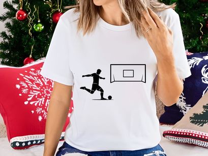 Soccer player kicking ball towards goal in a dynamic motion