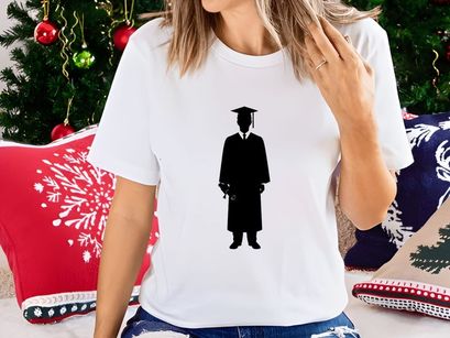 Graduate student holding diploma in academic gown and cap silhouette