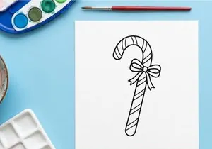 Christmas candy cane line art illustration with a decorative bow for holiday design