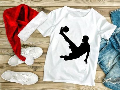 Silhouette of a soccer player performing an acrobatic kick