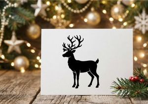 Black silhouette of a reindeer with large antlers isolated on a white background.
