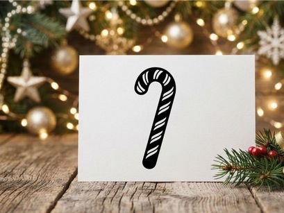 Ícono de bastón de caramelo en blanco y negro aislado sobre fondo blanco para diseño navideño