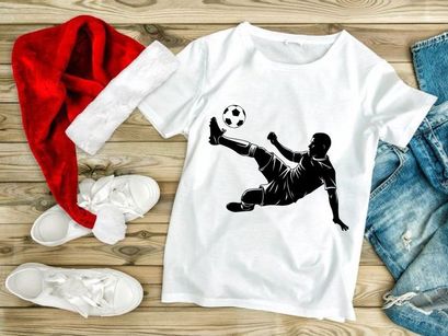 Soccer player in mid air kicking a ball with leg extended