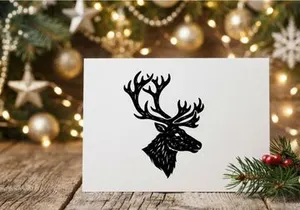 Black and white deer head silhouette illustration with detailed antlers for holiday design.