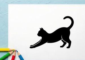 Silhouette of a stretching cat in black on white background